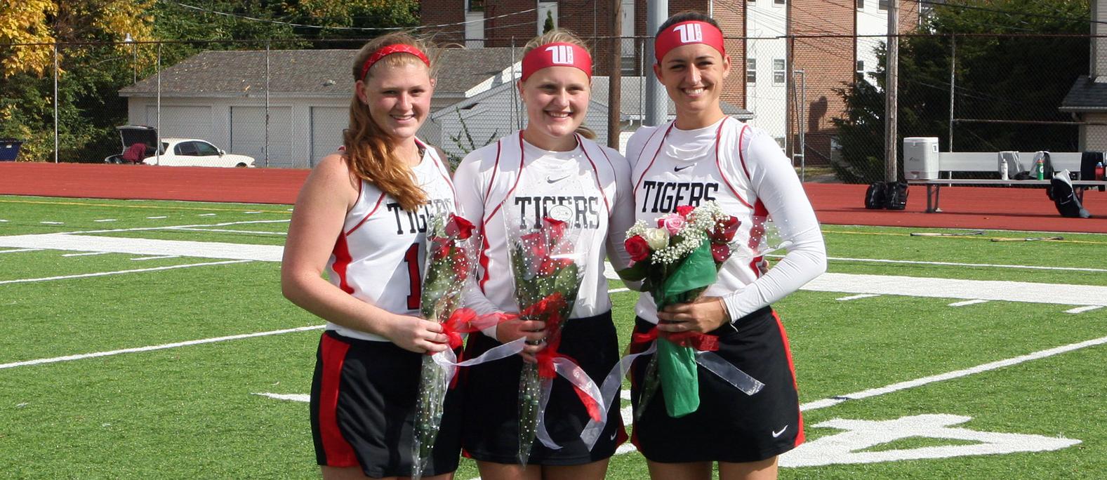 (From left) Seniors Emma Foster, Andrea Mattingly and Paige Vanerstrom before a 4-1 win over Oberlin. Photo by Hannah Yalaz