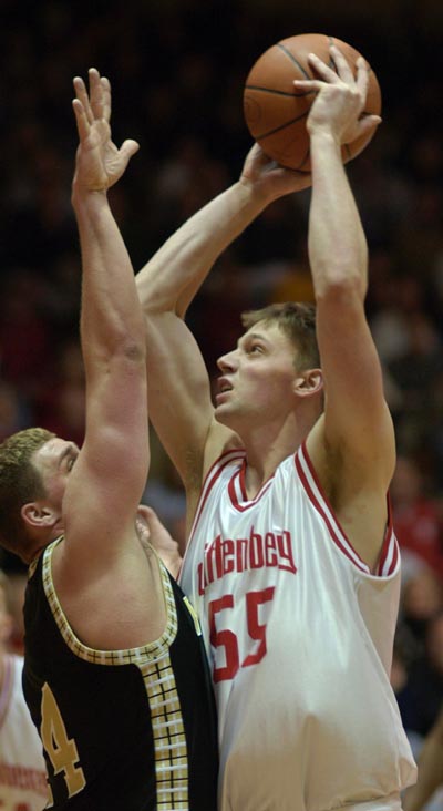 Wittenberg's Brian Gratsch goes up for a shot over Wooster's Matt Smith during the Tigers' 75-70 win on Saturday.