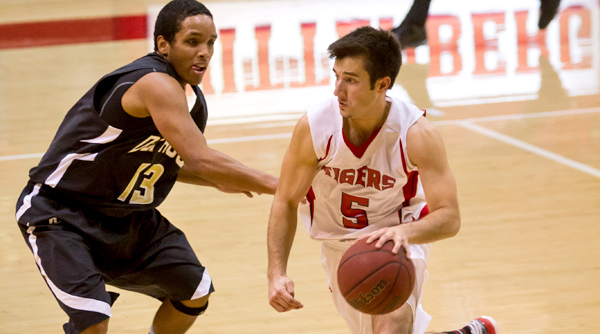 Junior Steven Newell scored 10 points to help the Tigers to a 68-62 win over Hiram on Saturday. File Photo | Erin Pence