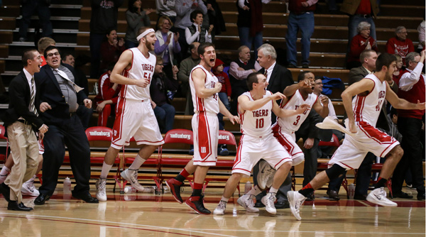 The Tiger bench erupts at the conclusion of Wittenberg's 62-60 overtime win over Ohio Wesleyan. Photo by Erin Pence