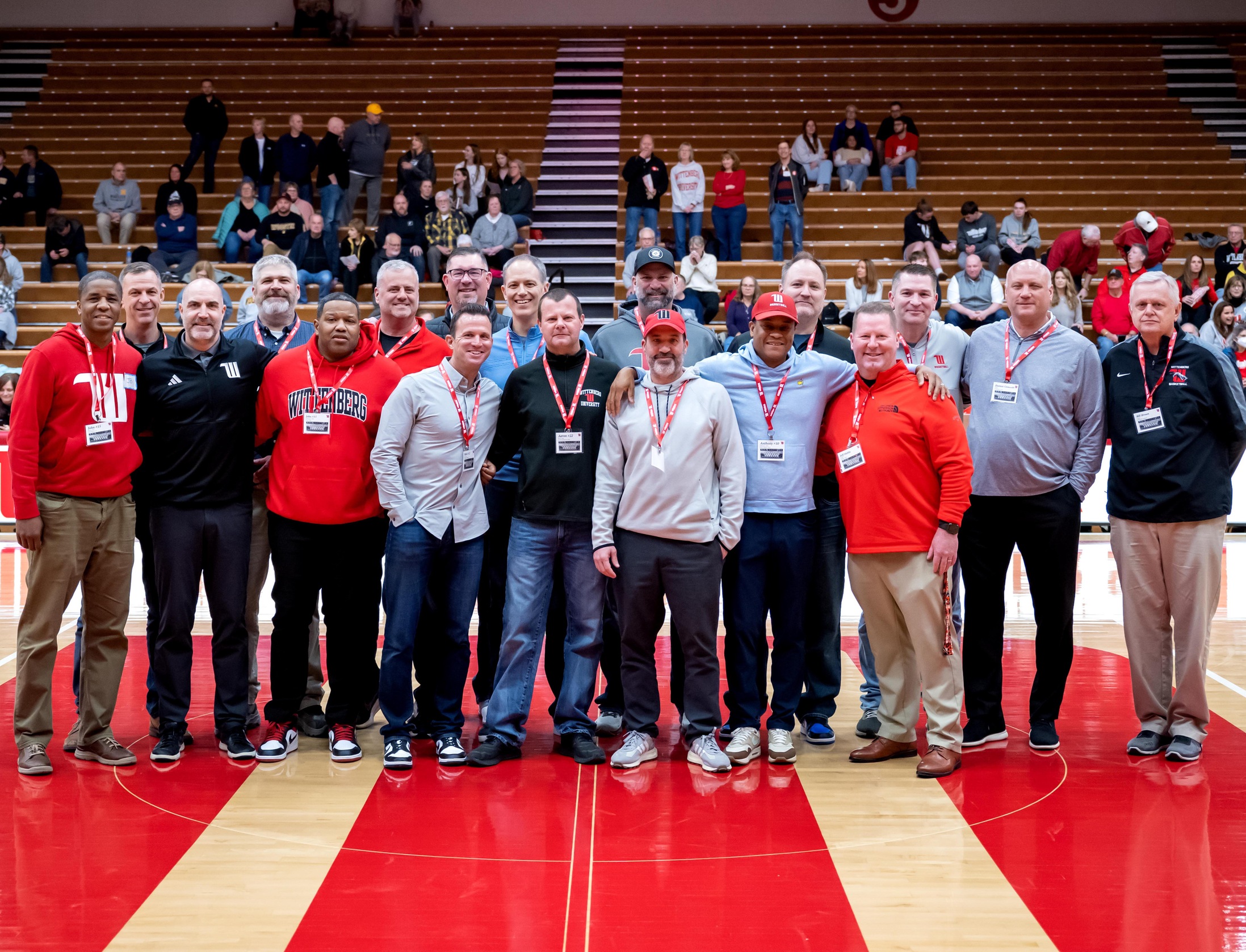 The players and coaches from the 1993-94 Wittenberg men's basketball team that reached the Final Four were recognized at halftime of Saturday's Champions Day game against Wooster. | Photo by John Coffman