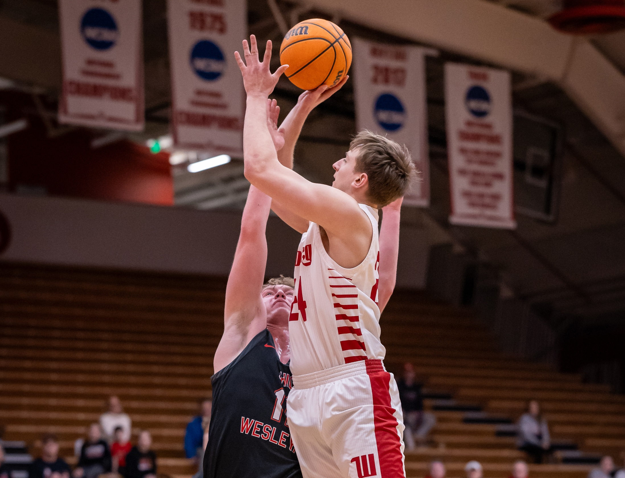 Wittenberg freshman Tyler Galluch attempts a shot during the Tigers' 71-59 win over Ohio Wesleyan in the NCAC Tournament quarterfinals on Tuesday. | Photo by Pam Klopfer