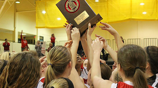 The Tigers held the trophy aloft after winning the NCAC title. Photo courtesy North Coast Athletic Conference