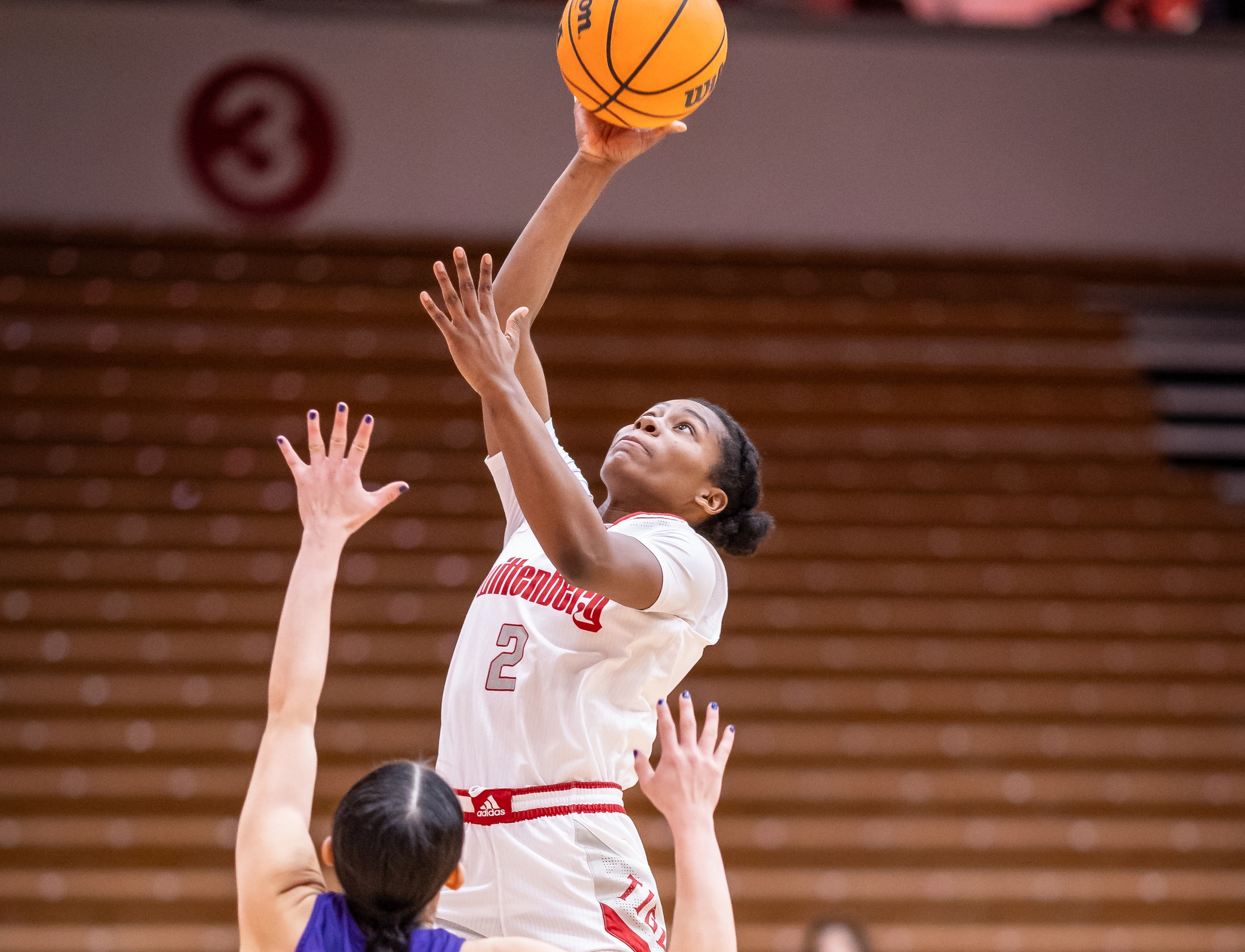 Wittenberg junior Jazmyn Gaines-Burns attempts a shot during the Tigers' 80-39 win over Kenyon in the NCAC Tournament quarterfinals on Tuesday. | Photo by Pam Klopfer