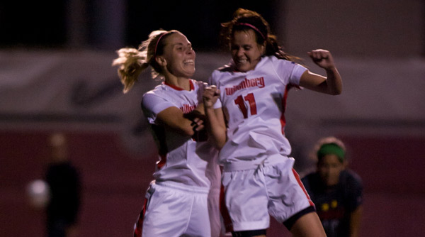 Kailey Striebel (12) and Katie Murphey (11) celebrate Striebel's goal in the 90th minute of a 2-0 win over Ohio Wesleyan. Photo by Erin Pence