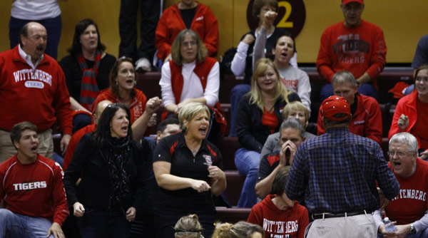 Director of Athletics and Recreation Garnett Purnell (blue shirt with back to camera) leads the Wittenberg cheering section during a 3-0 win over Hope. Photo by Paul Evans