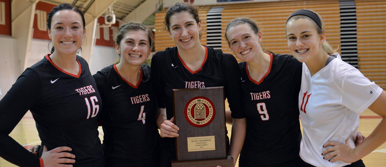 Wittenberg's captains show off their 2015 NCAC Tournament championship trophy. Photo by Nick Falzerano
