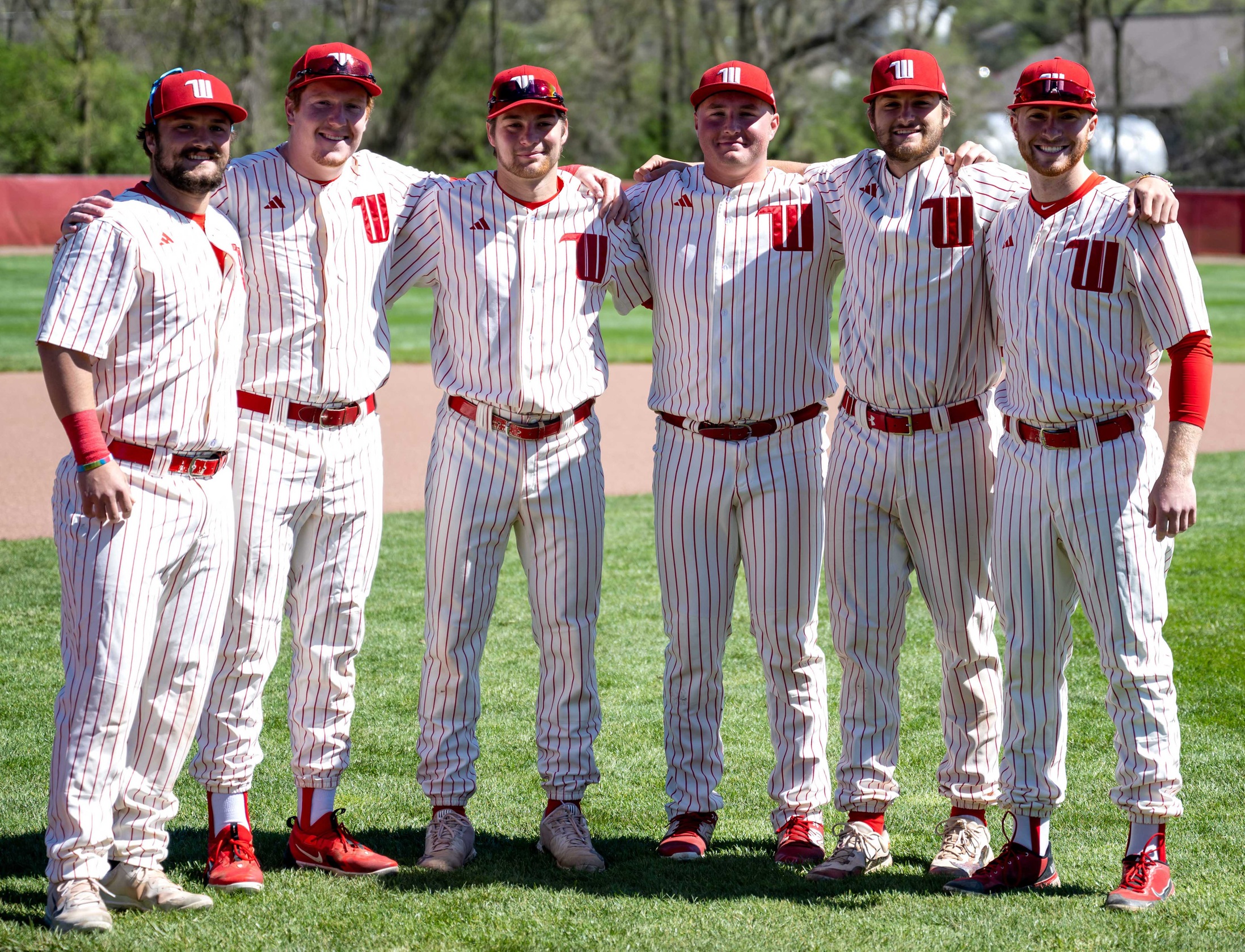 The Wittenberg baseball team's six-member senior class of 2024 celebrates Senior Day prior to a doubleheader sweep of Oberlin on Saturday. | Photo by John Coffman