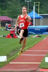 Joe Rumschlag competes in the triple jump